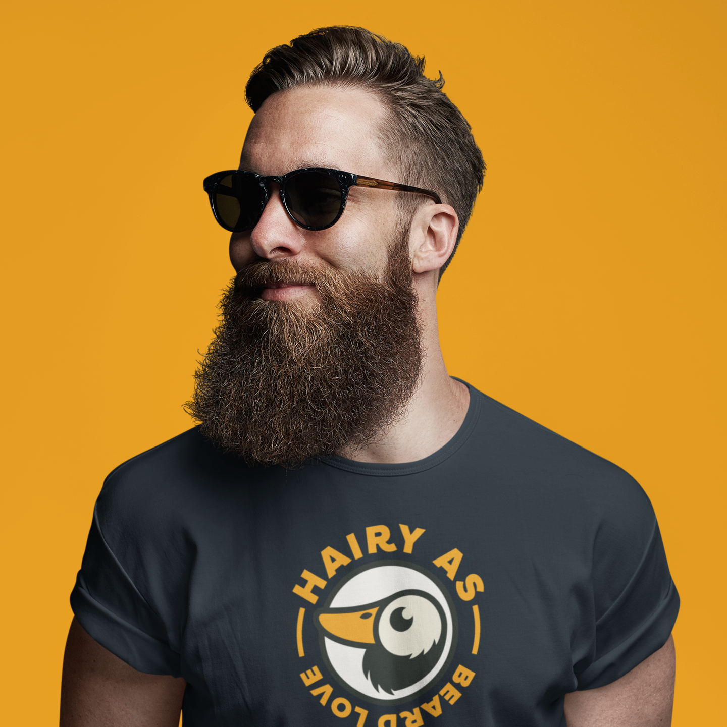 Hairy As Beard Love Black organic cotton T-Shirt with Roundel Logo using orange text. Worn by a young man with a beautiful big beard.