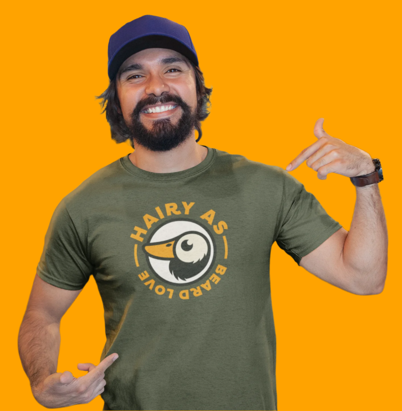 Hairy As Beard Love Green organic cotton T-Shirt with Roundel Logo using orange text. Worn by a younger man with a closely cropped beard who is pointing at the logo.